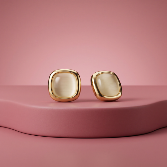 Gold plated square cabochon stud earrings with warm cream cat-eye stone and rounded corners
