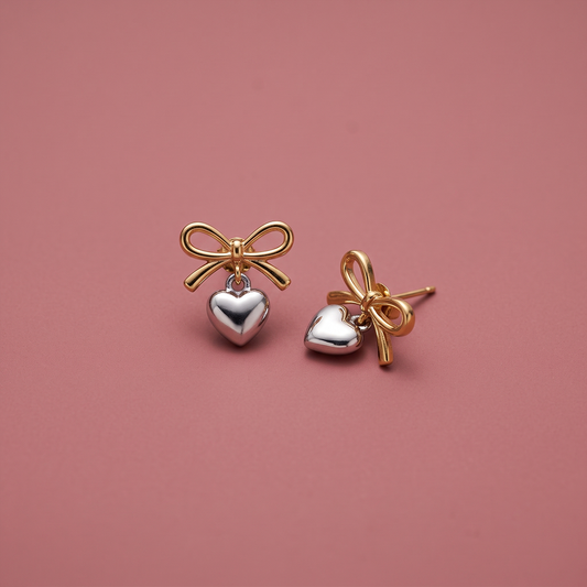 Gold and silver bow heart drop earrings in stainless steel with gold-plated finish