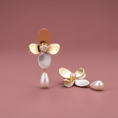 Mixed-metal floral drop earrings with gold petals, silver petal, clear stone and ivory teardrop pearl
