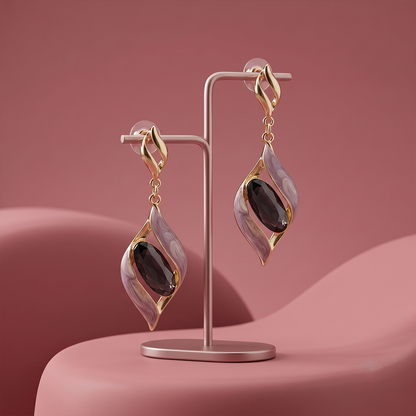 Two-section articulated drop earrings showing the connected, moving design