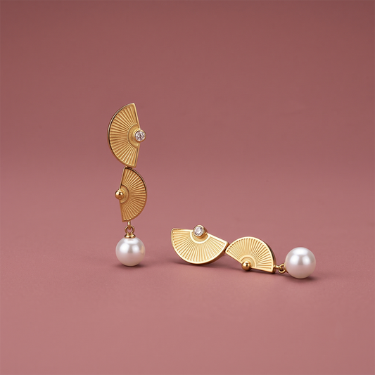 Gold plated geometric drop earrings with pleated fan tiers, clear stone and white pearl