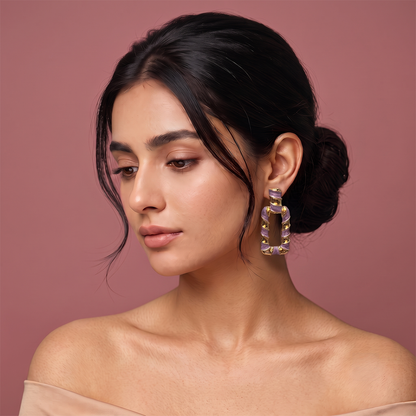 Gold plated purple enamel geometric hoop earrings with rectangular open design worn by a woman